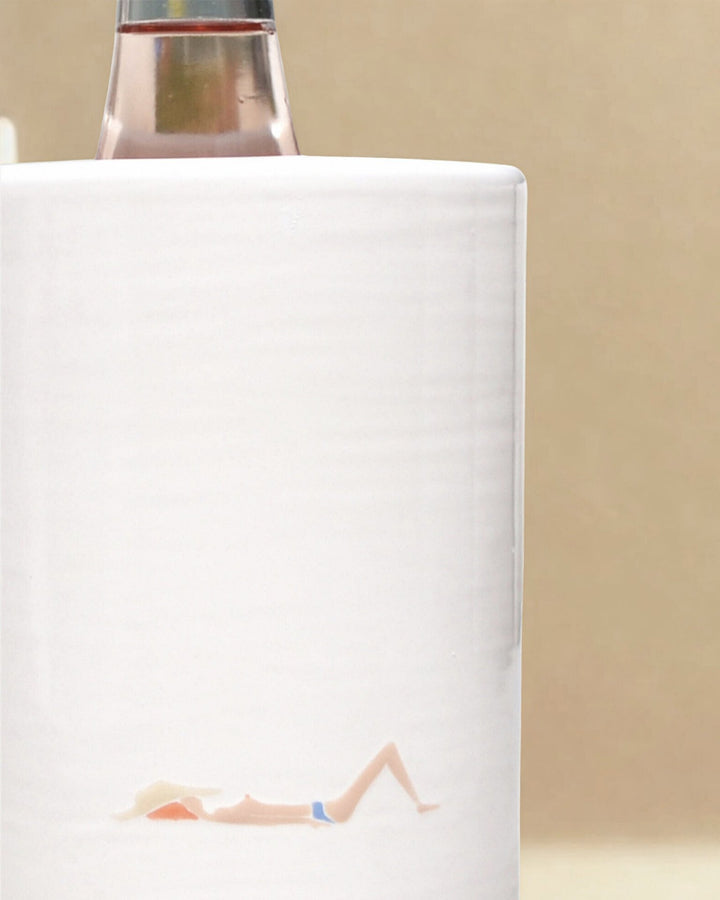 White bottle cooler with illustration on a beige background