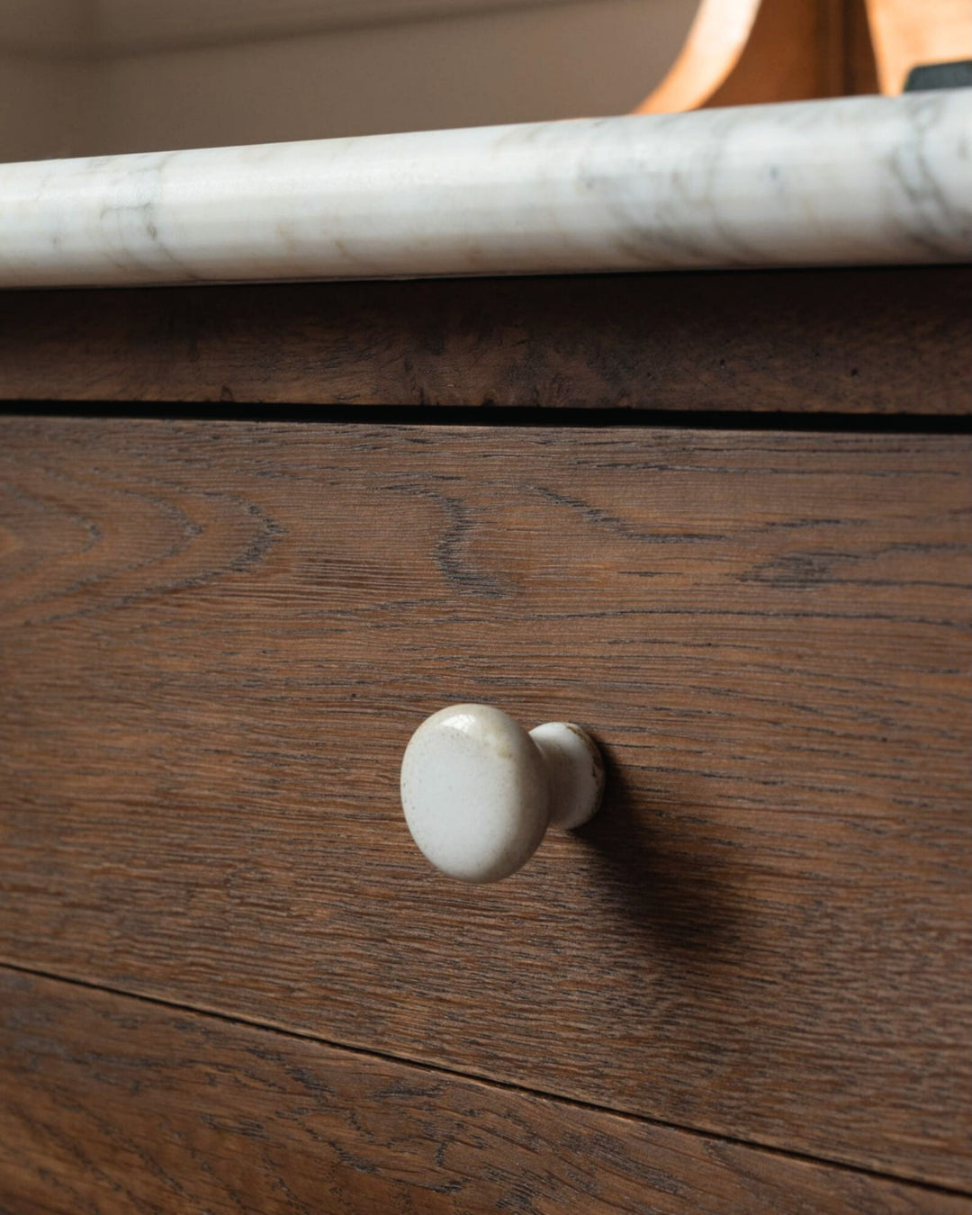 Wooden drawer with a white marble handle