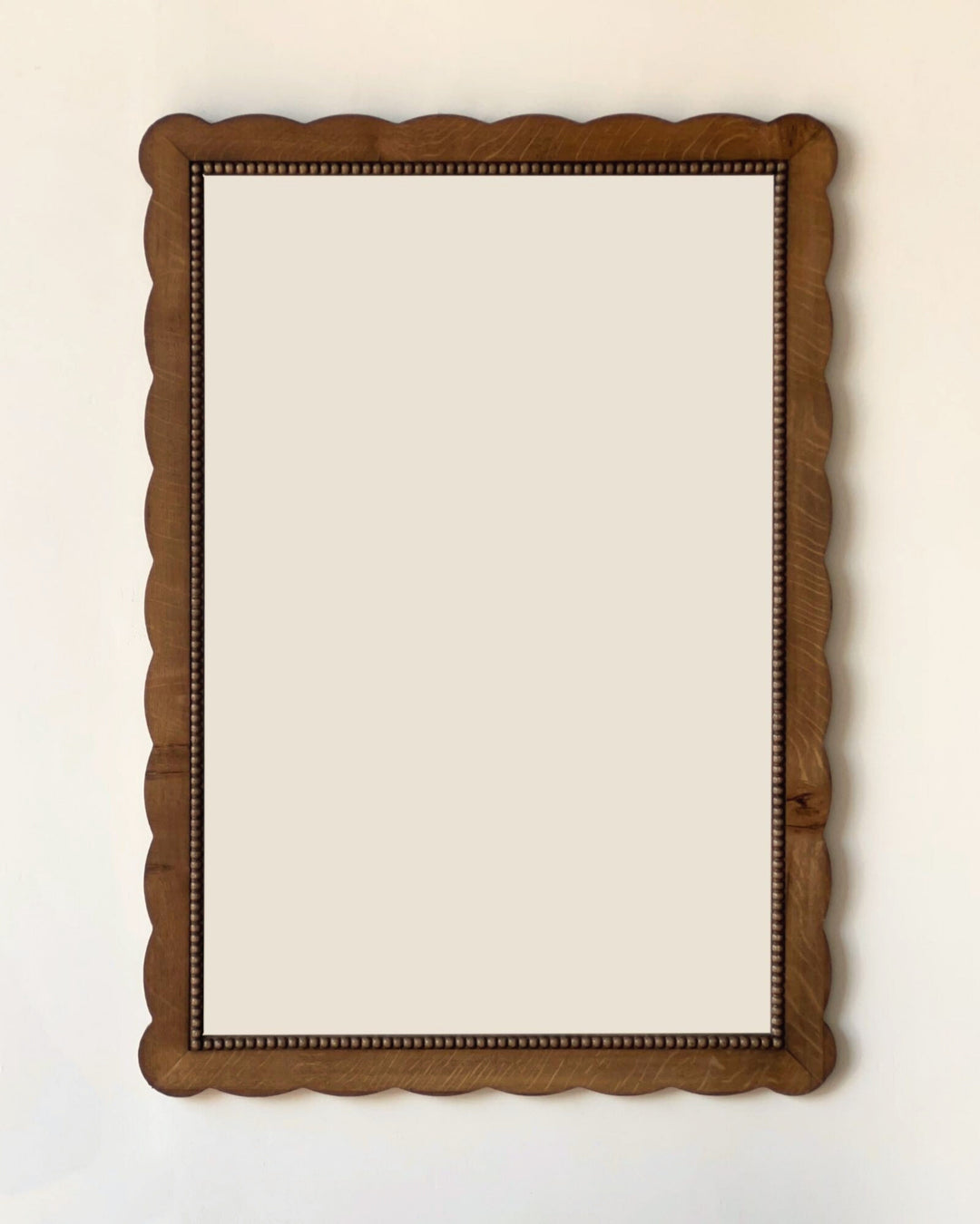 Wooden mirror on a white background