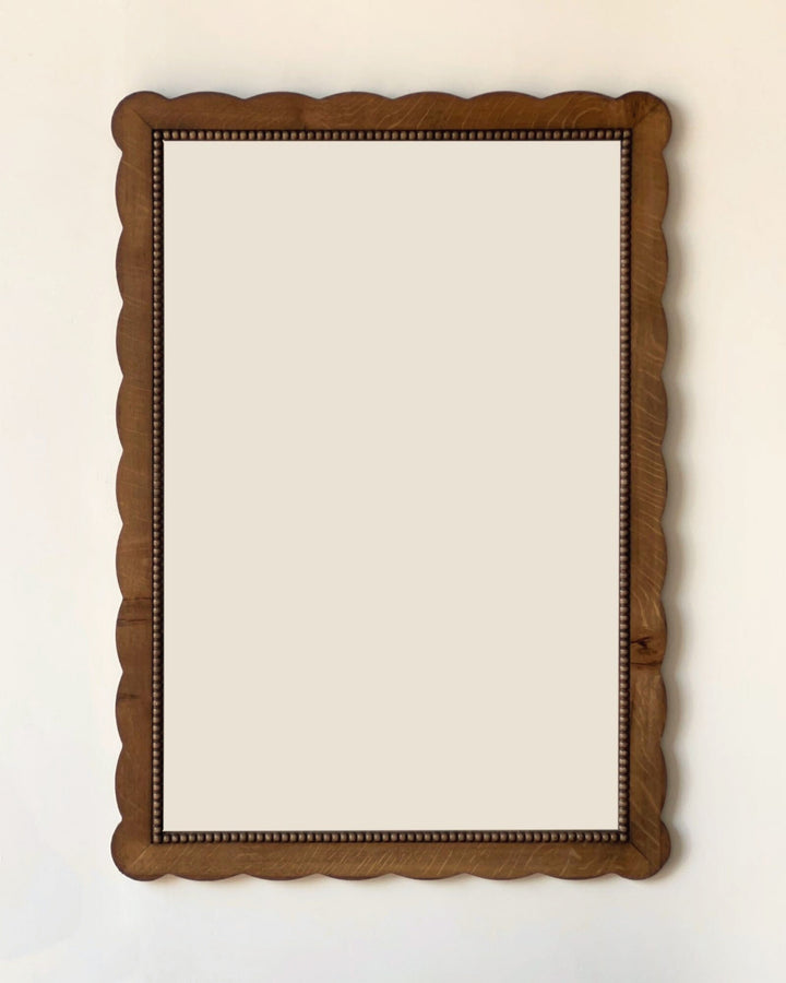 Wooden mirror on a white background