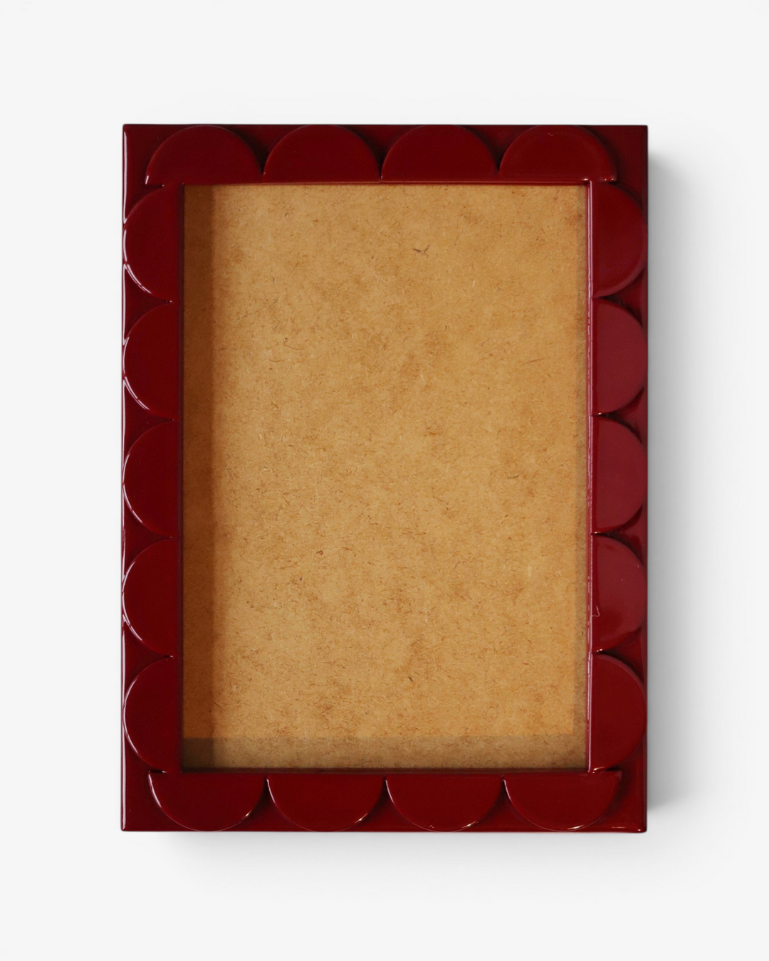 Red decorative scallop picture frame on a white background