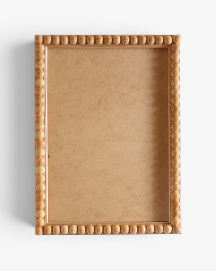 Natural wood bobbin photo frame on a white background