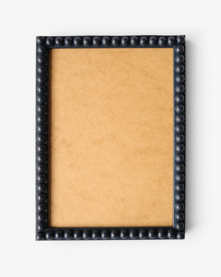 Navy bobbin picture frame on a white background