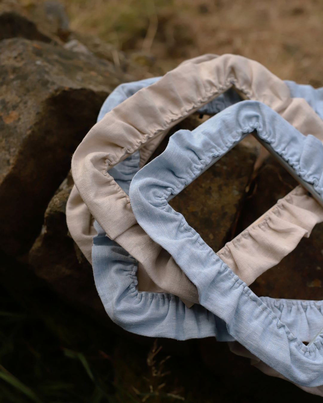Close-up of a fabric-covered frames on a natural background