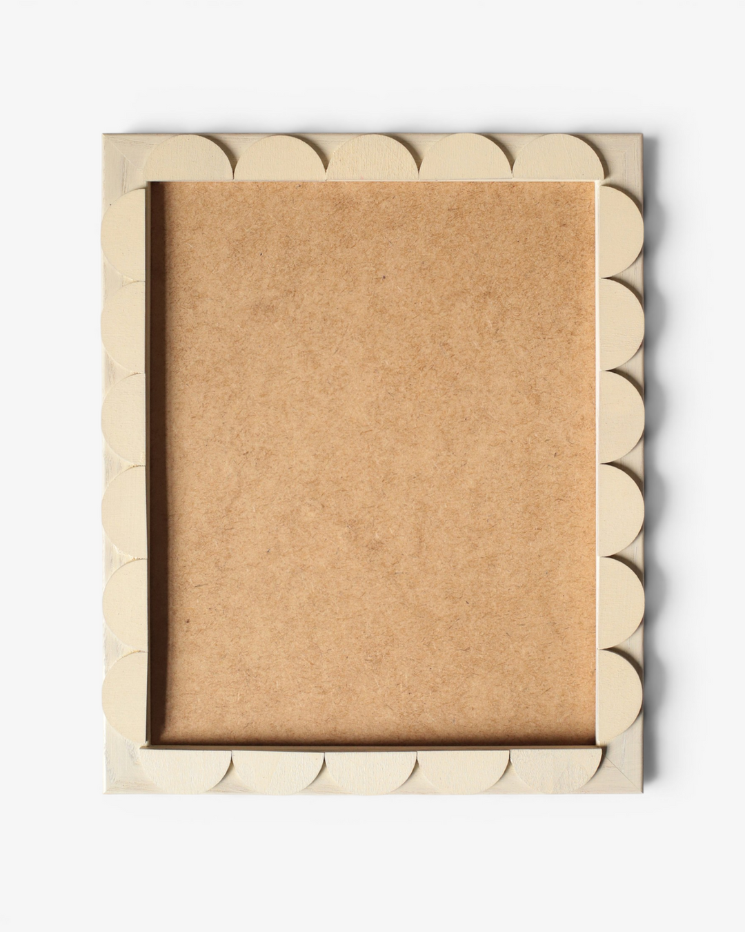 Beige scalloped photo frame on white background