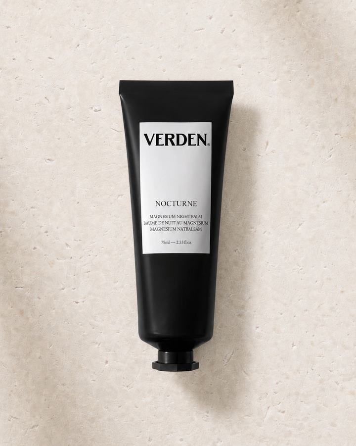 Black tube of Verden hand cream on a beige background