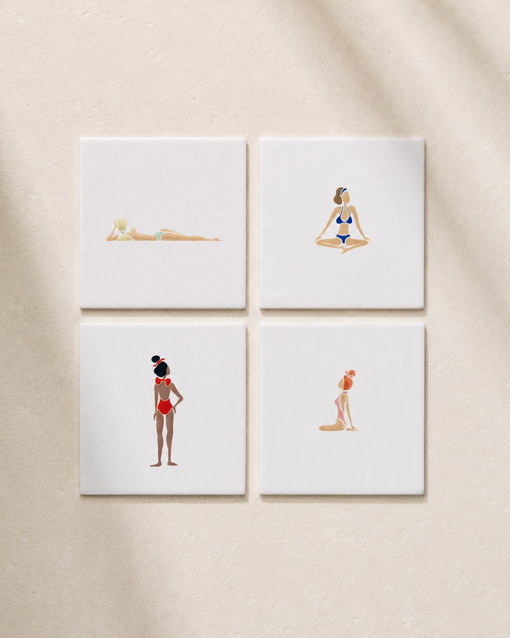 Four square tile coasters with illustrations of women in swimsuits on a beige background