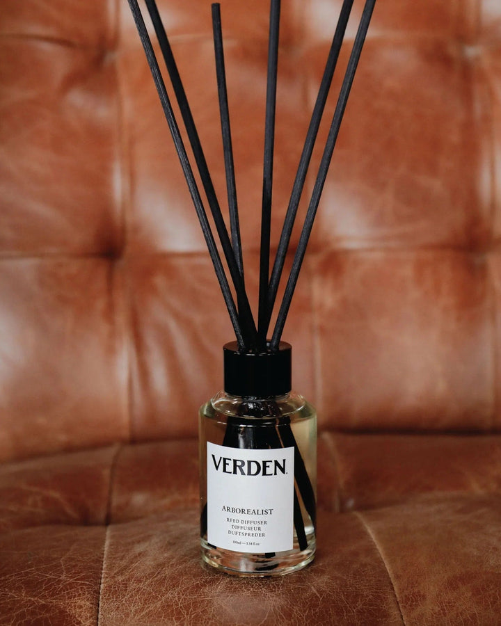 Reed diffuser on red leather sofa