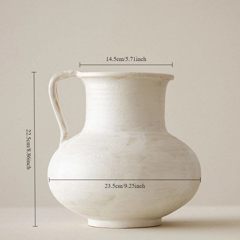 White ceramic pitcher with dimensions indicated on a beige background