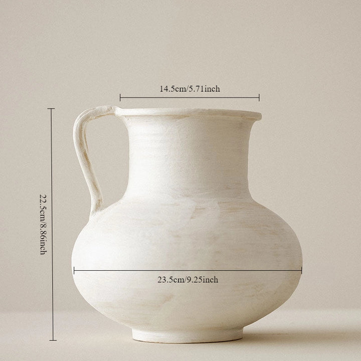 White ceramic pitcher with dimensions indicated on a beige background