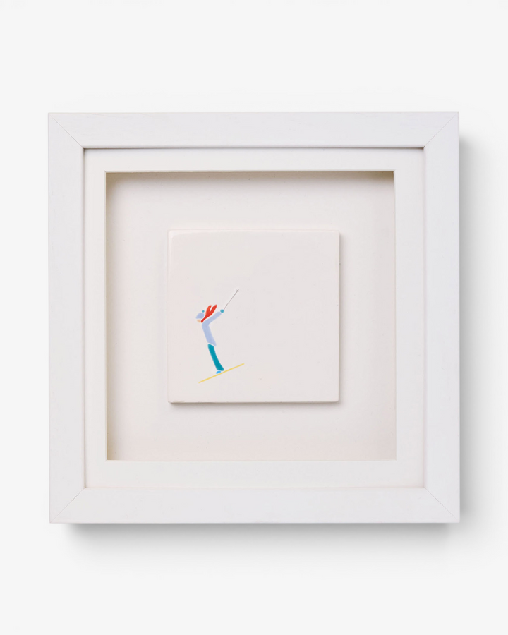 Framed artwork of a skier on a white background