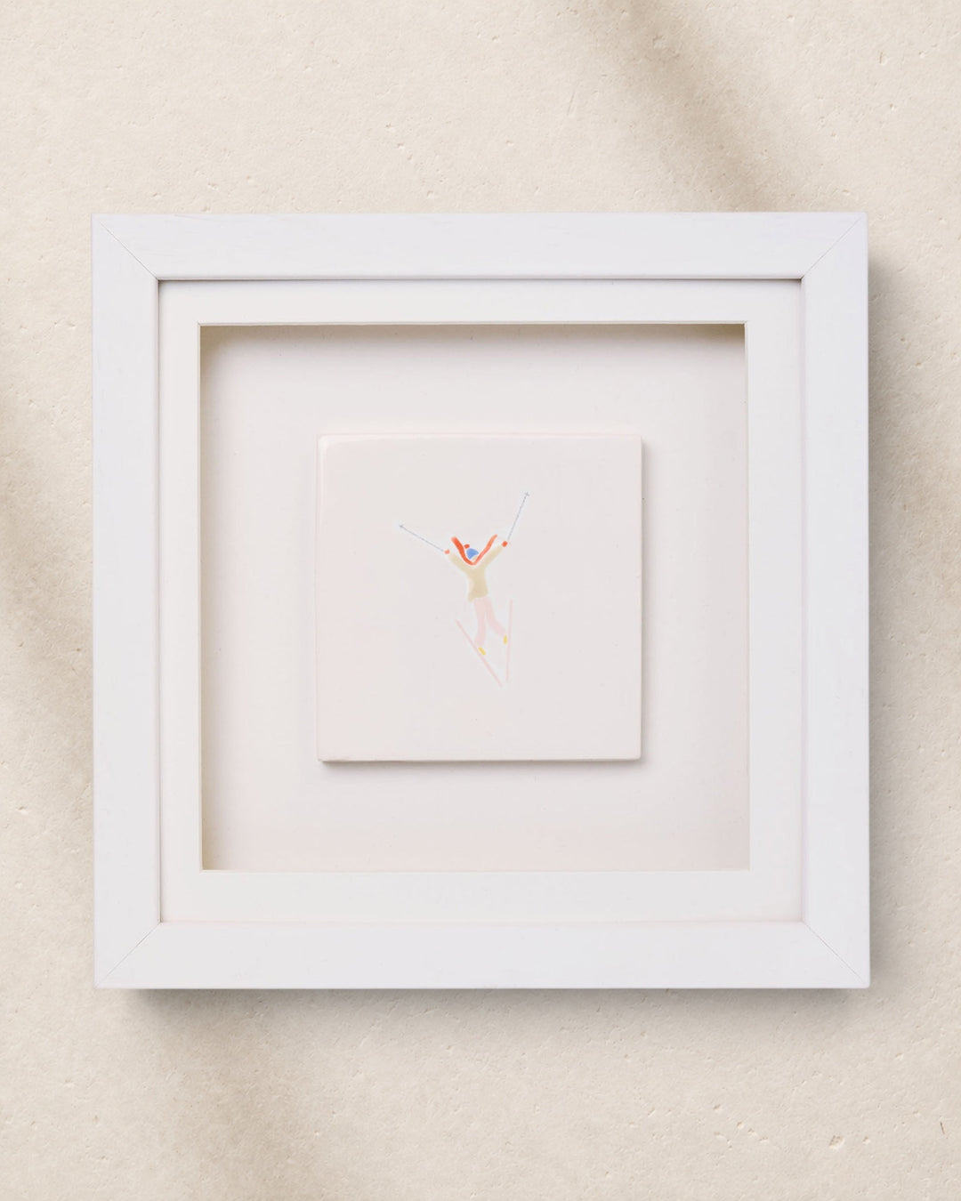 Framed artwork with a minimalistic design on a beige background