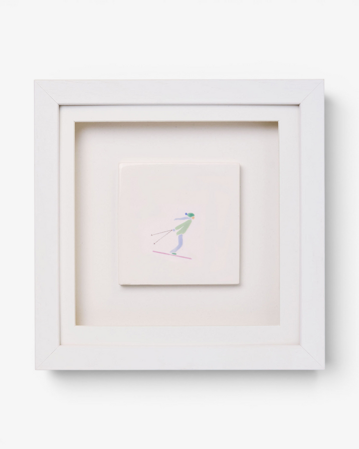 Framed artwork of a skier on a white background