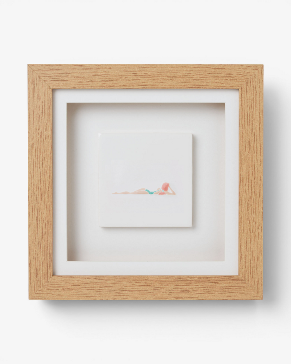 Wooden picture frame with  artwork inside on a light gray background