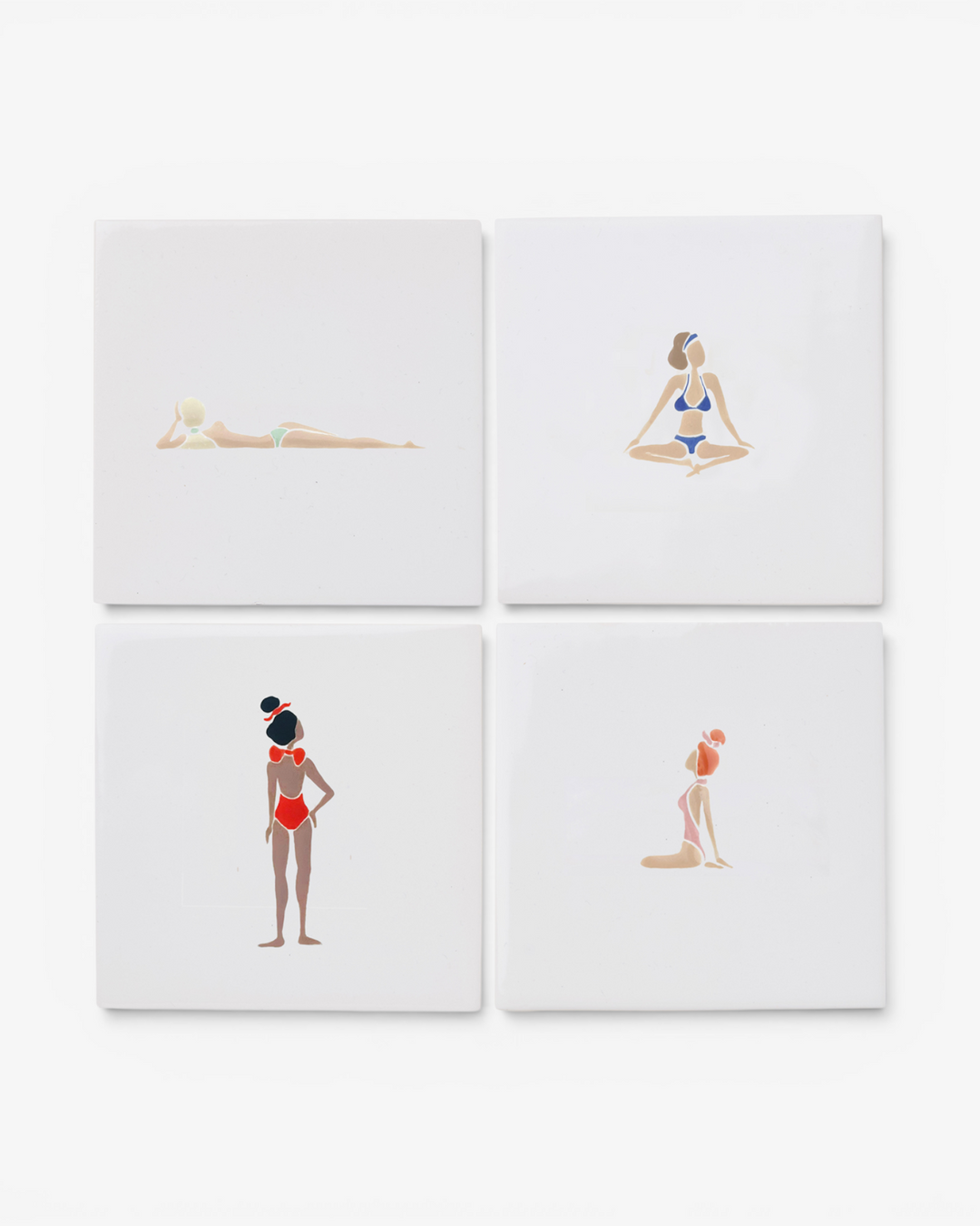 Four square ceramic coasters with illustrations of women in swimsuits on a white background