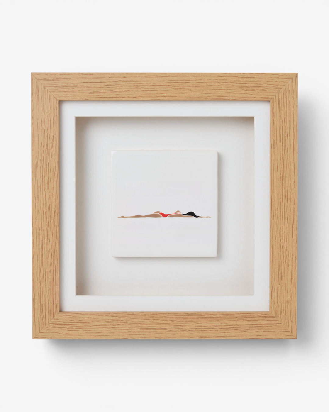 Framed artwork of a swimmer in a minimalistic style on a white background