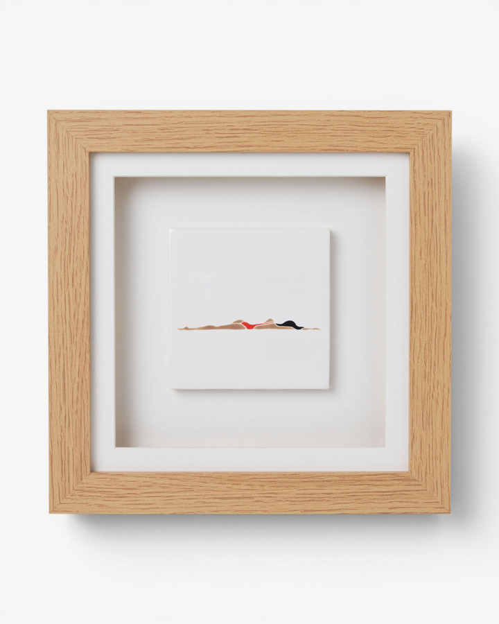 Framed artwork of a swimmer in a minimalistic style on a white background
