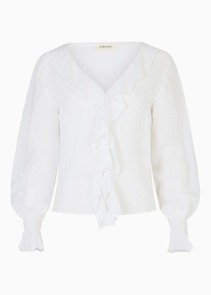 White blouse with ruffles and puff sleeves on a white background