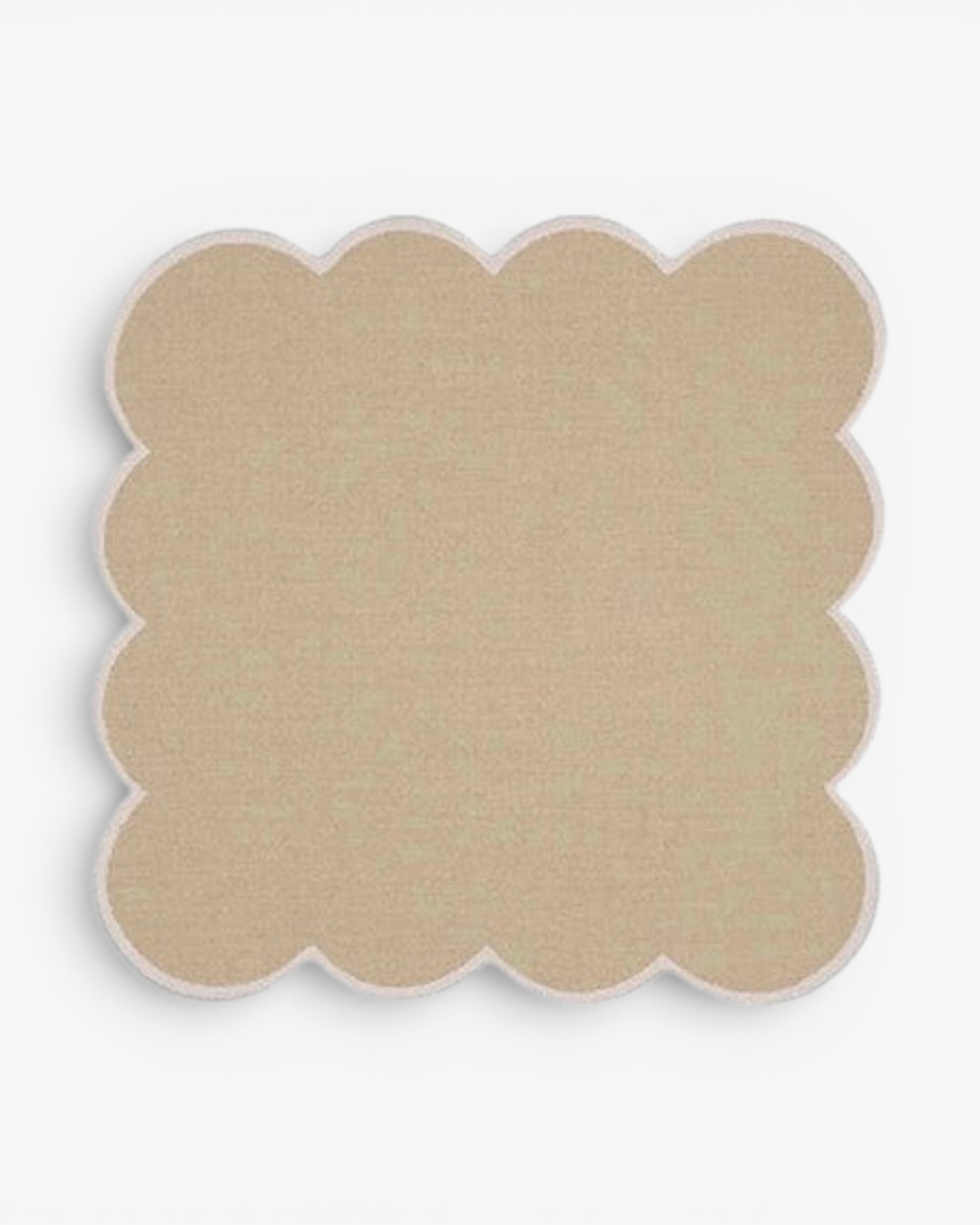 Beige scalloped cocktail napkin on a white background