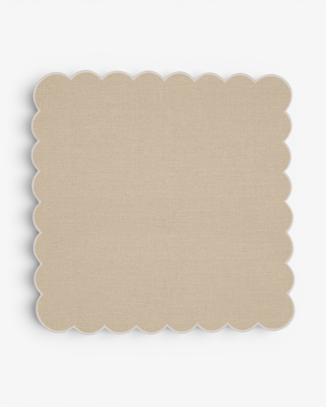 Beige scalloped napkin on a white background
