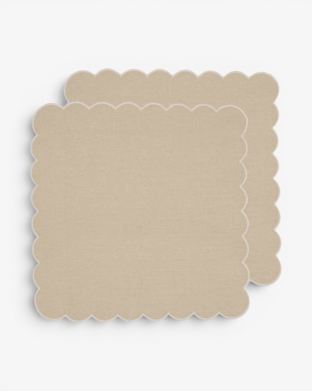 Beige scalloped napkin on a white background