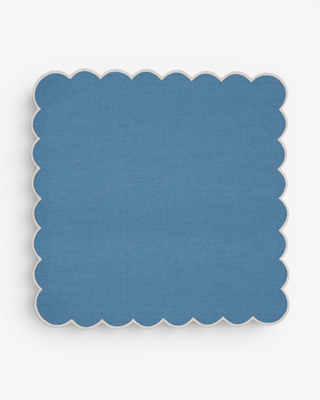 Blue scalloped napkin on a white background
