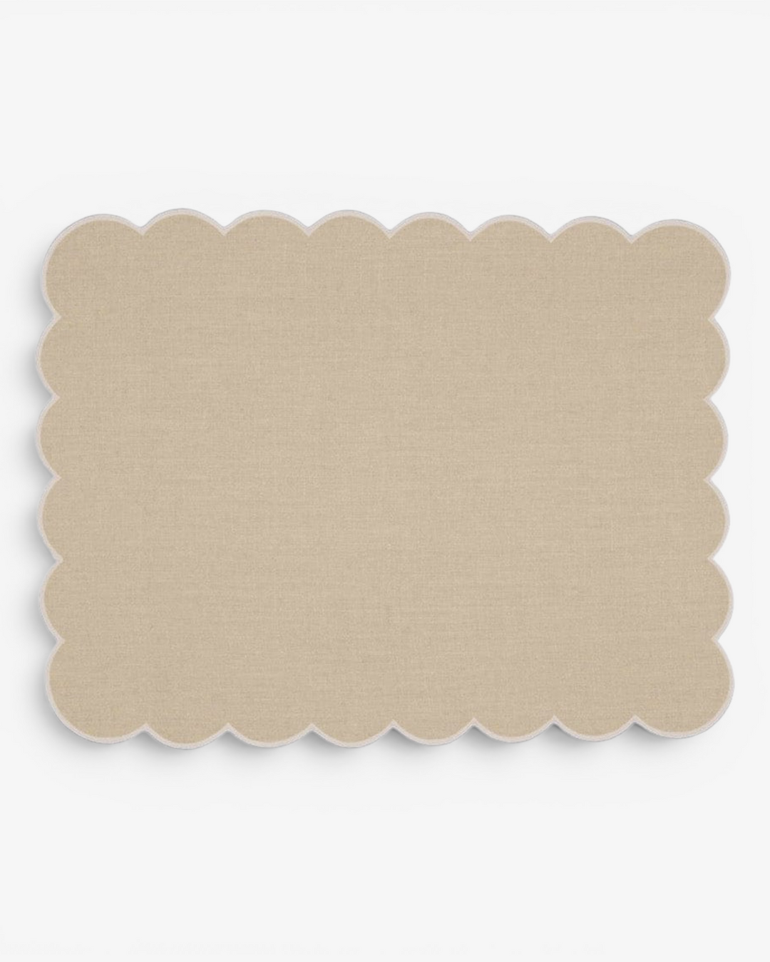 Beige scalloped placemat on a white background