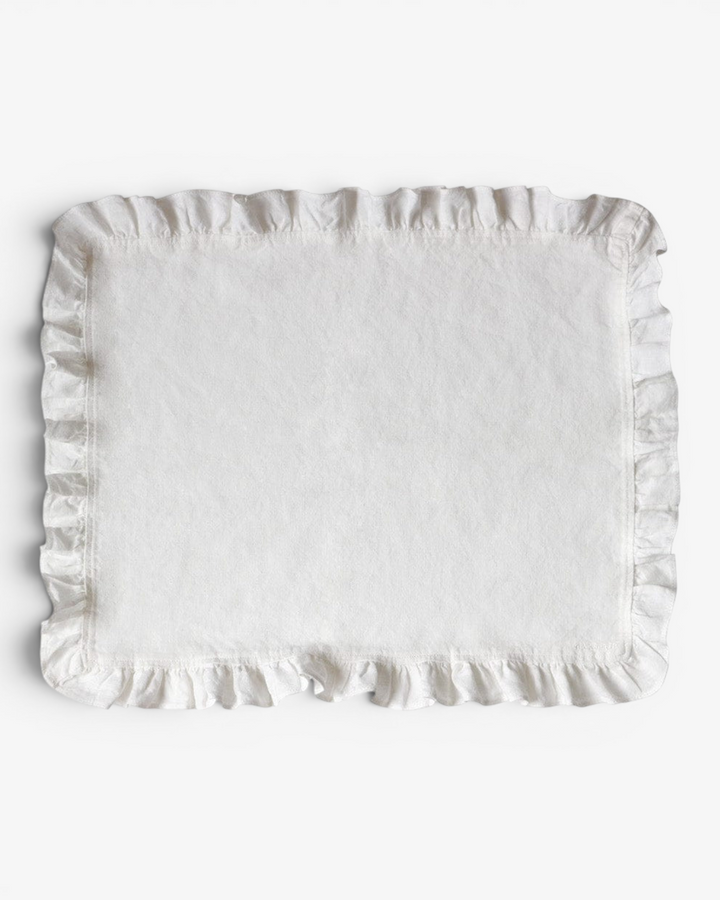 White placemat with ruffled edges on a white background