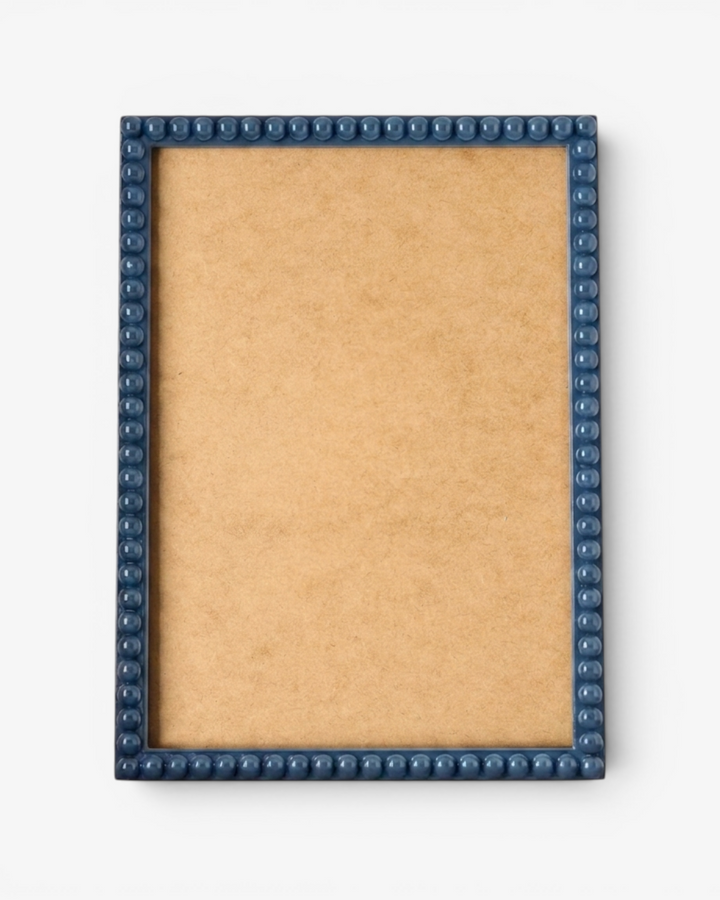 Blue bobbin photo frame on a white background