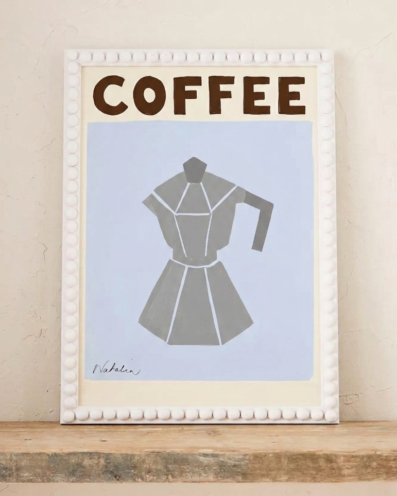 White bobbin photo frame with coffee on neutral background