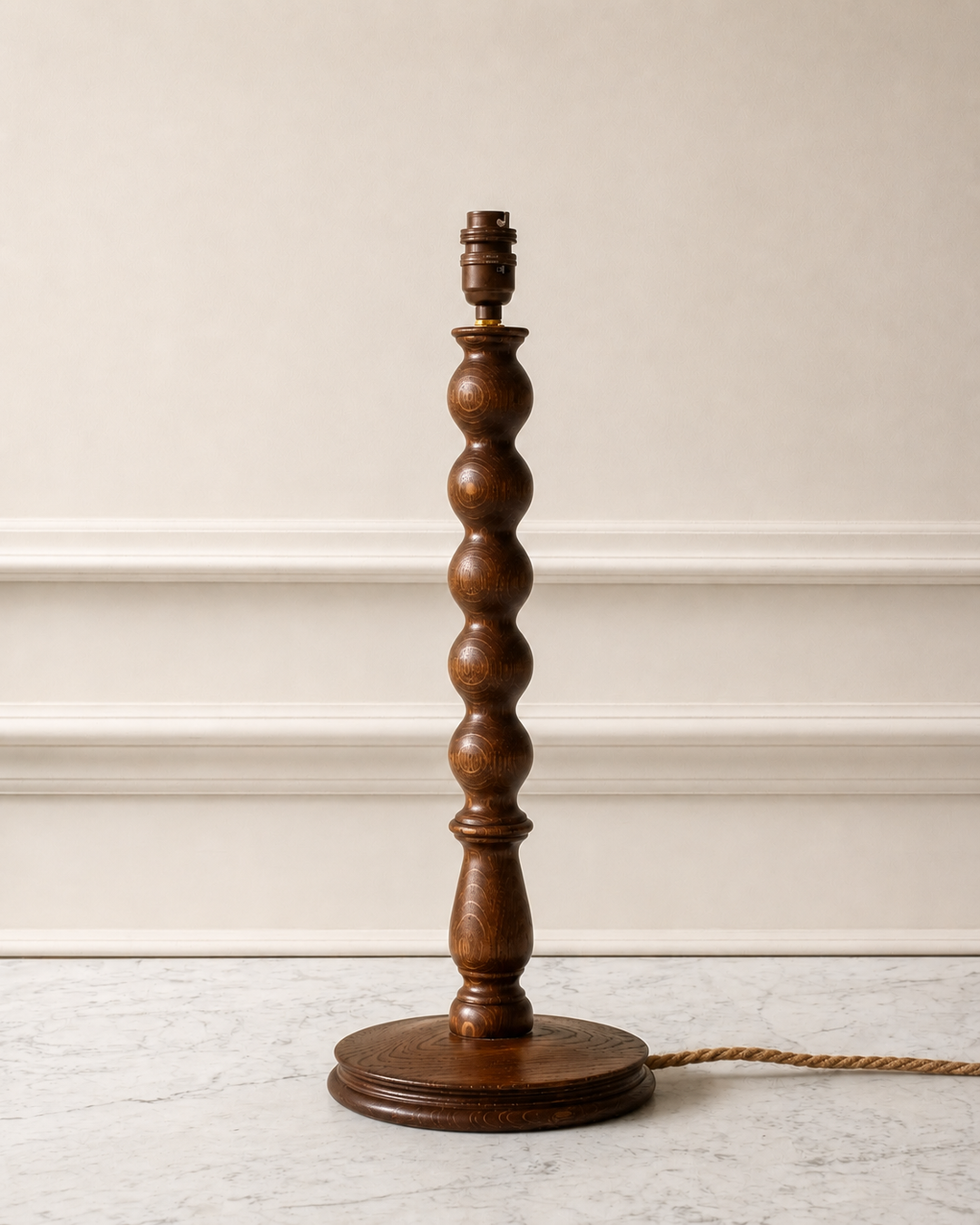 Wooden lamp with a textured base on a light background