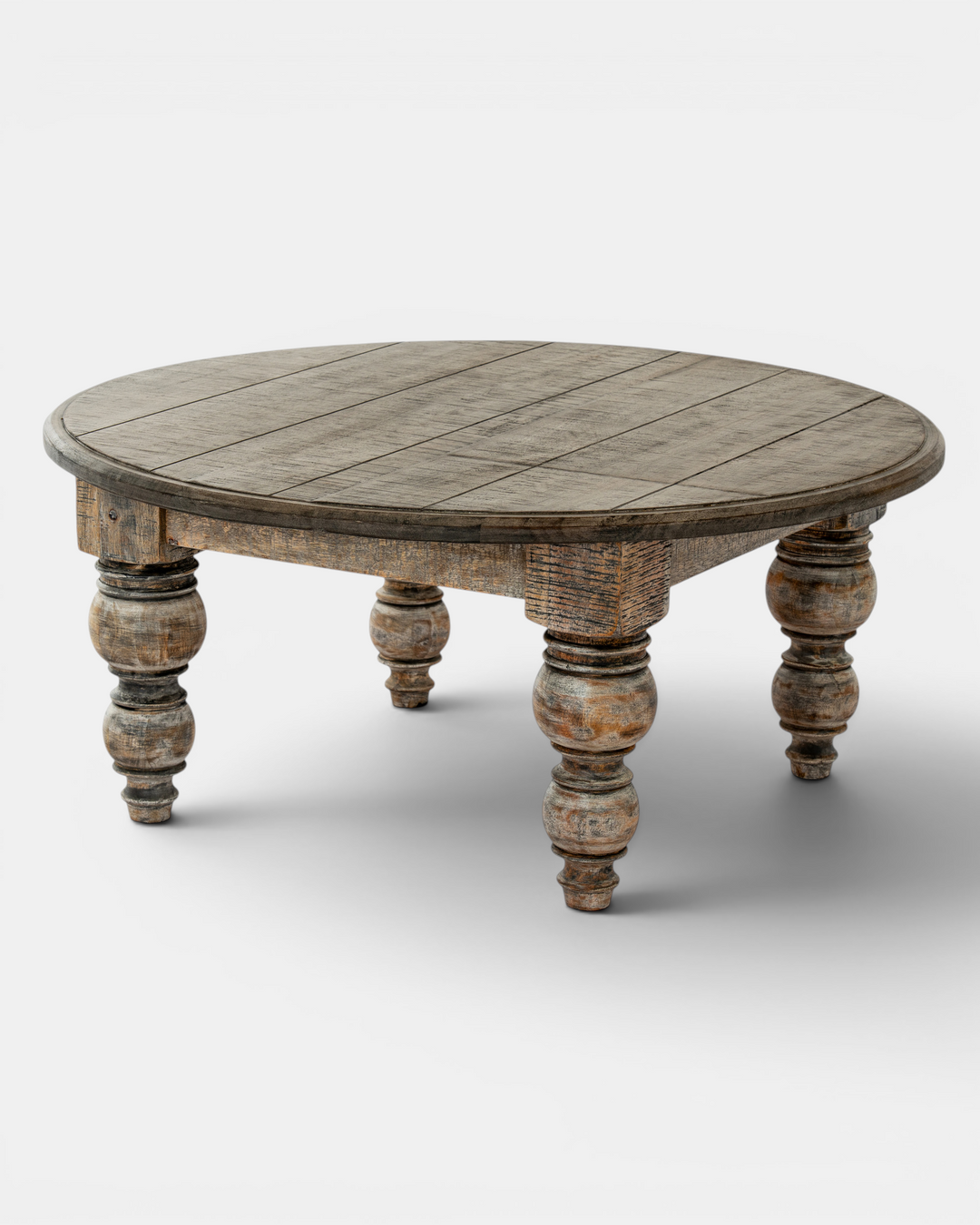 Round wooden coffee table with turned legs on a white background