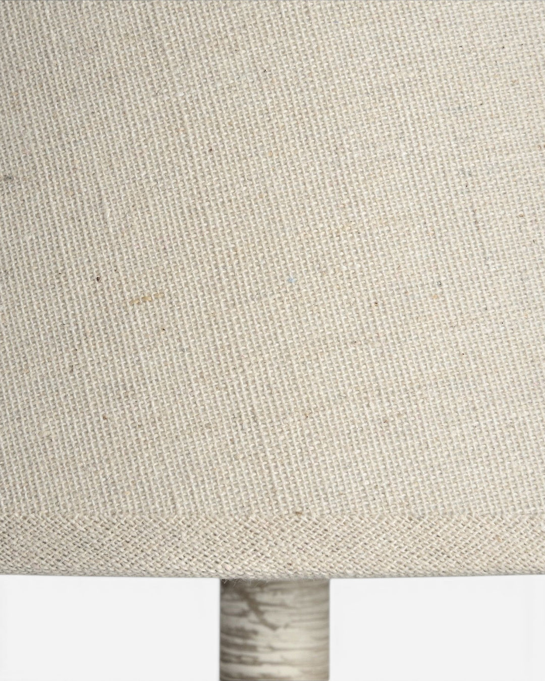 Close-up of a textured beige fabric lampshade