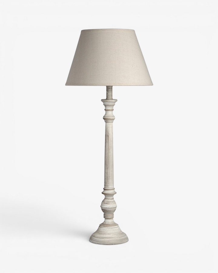 White table lamp with a beige lampshade on a white background