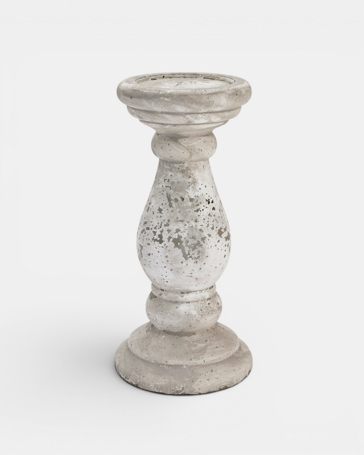 Decorative stone candle holder on a white background