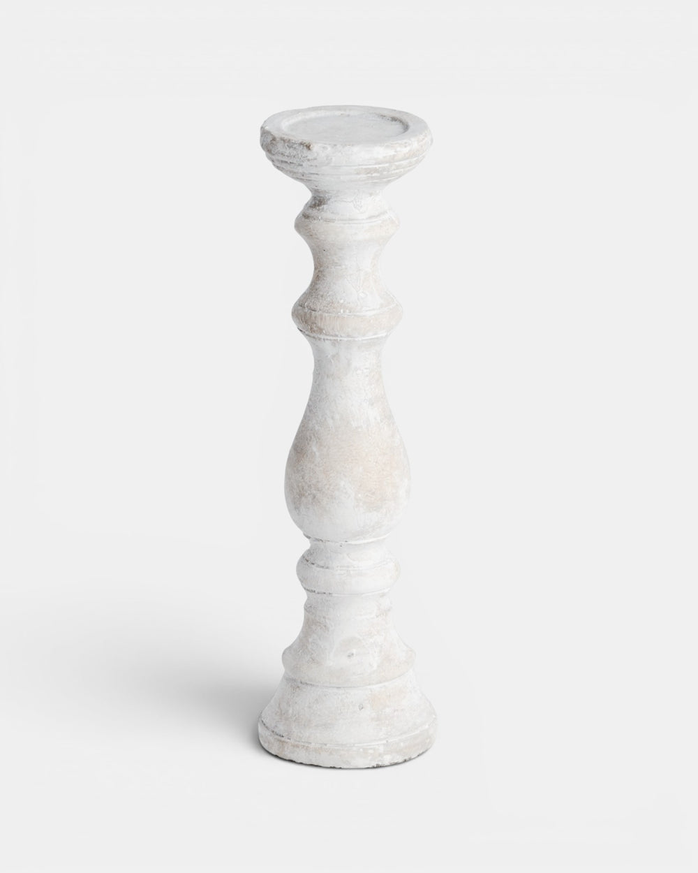 White candle holder on a light gray background