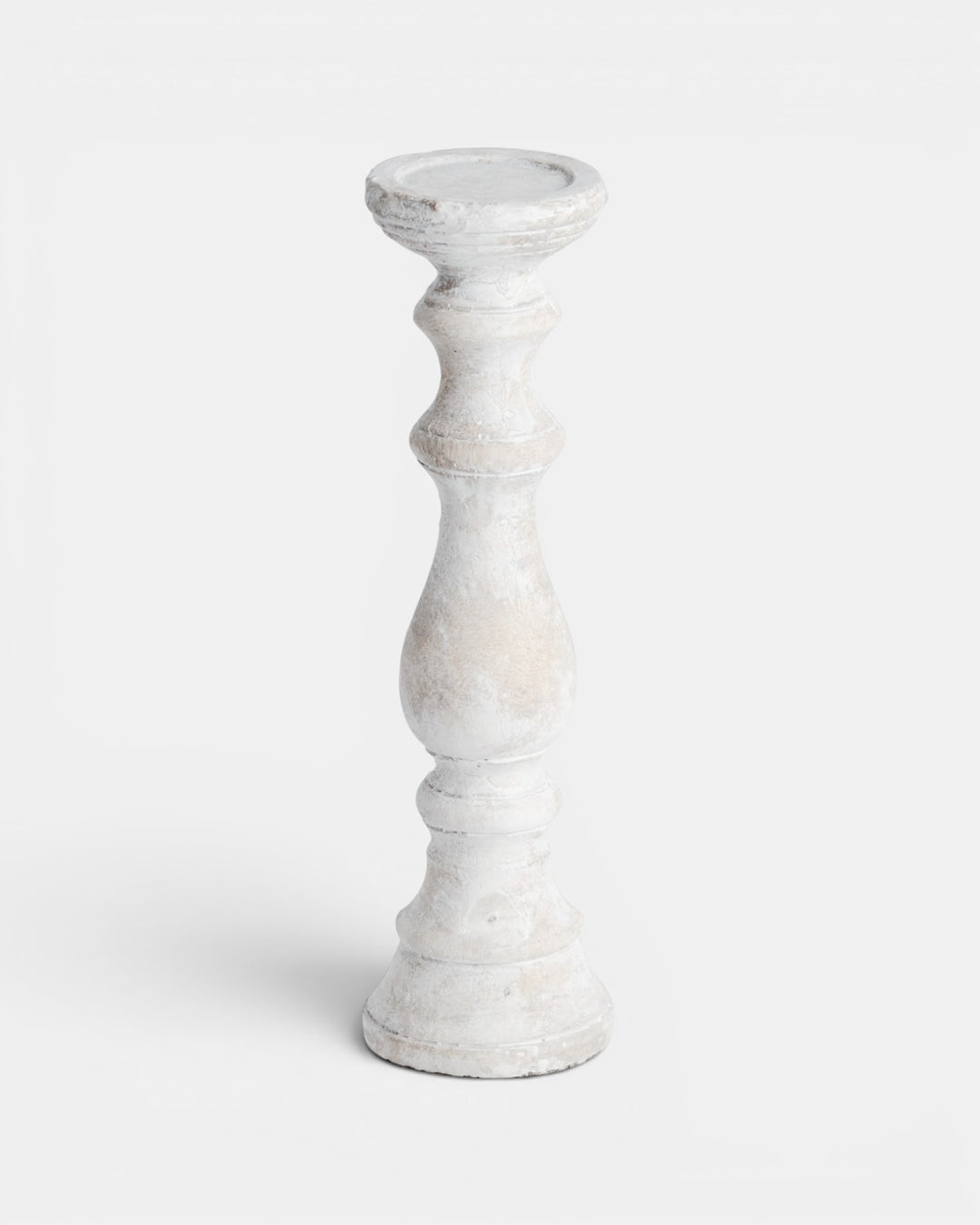 White candle holder on a light gray background