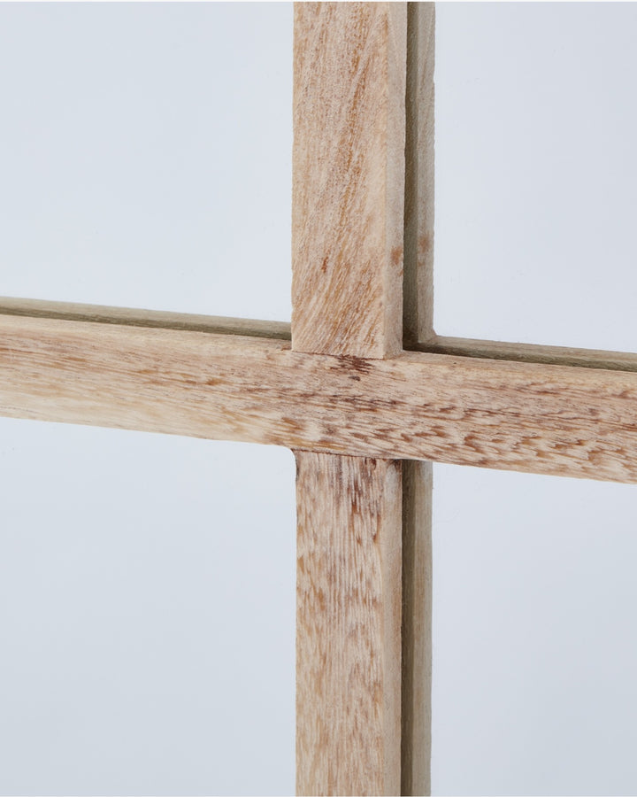 Close-up of a wooden mirror on a white background