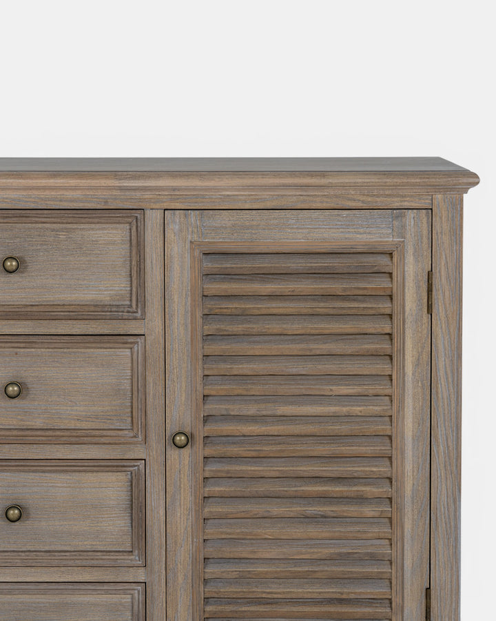 Wooden cabinet with drawers and a shutter door on a white background