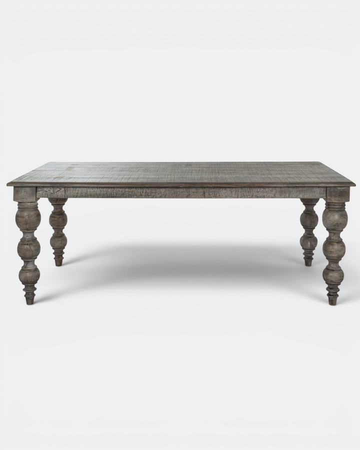 Wooden table with turned legs on a white background