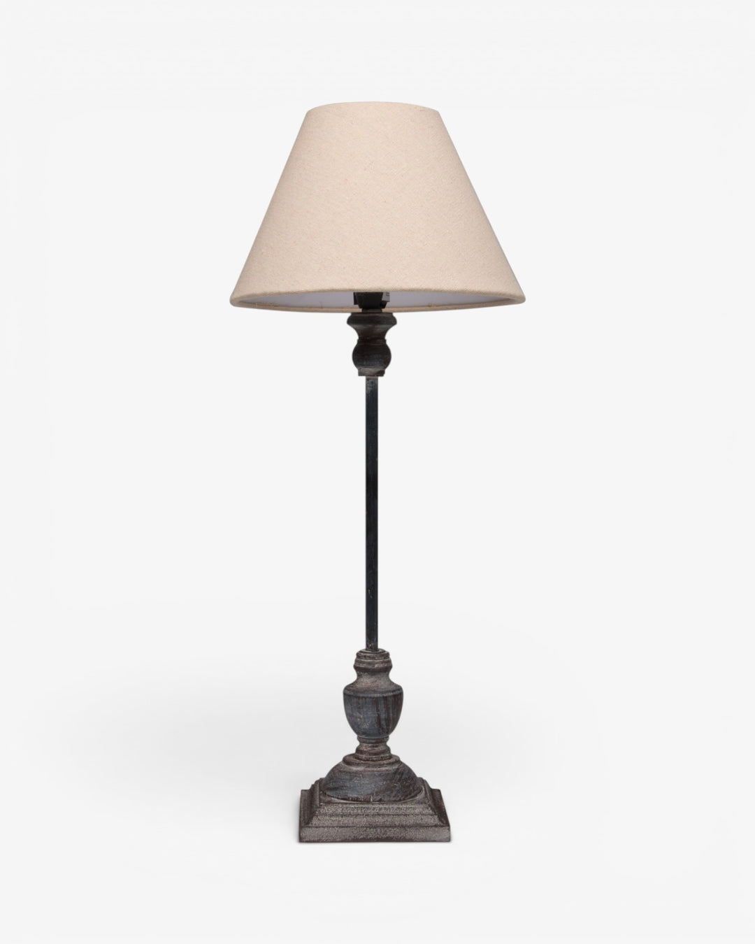 Table lamp with a beige shade on a white background