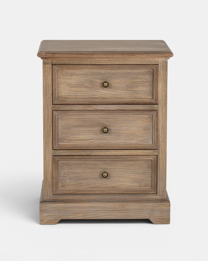 Wooden nightstand with three drawers on a white background