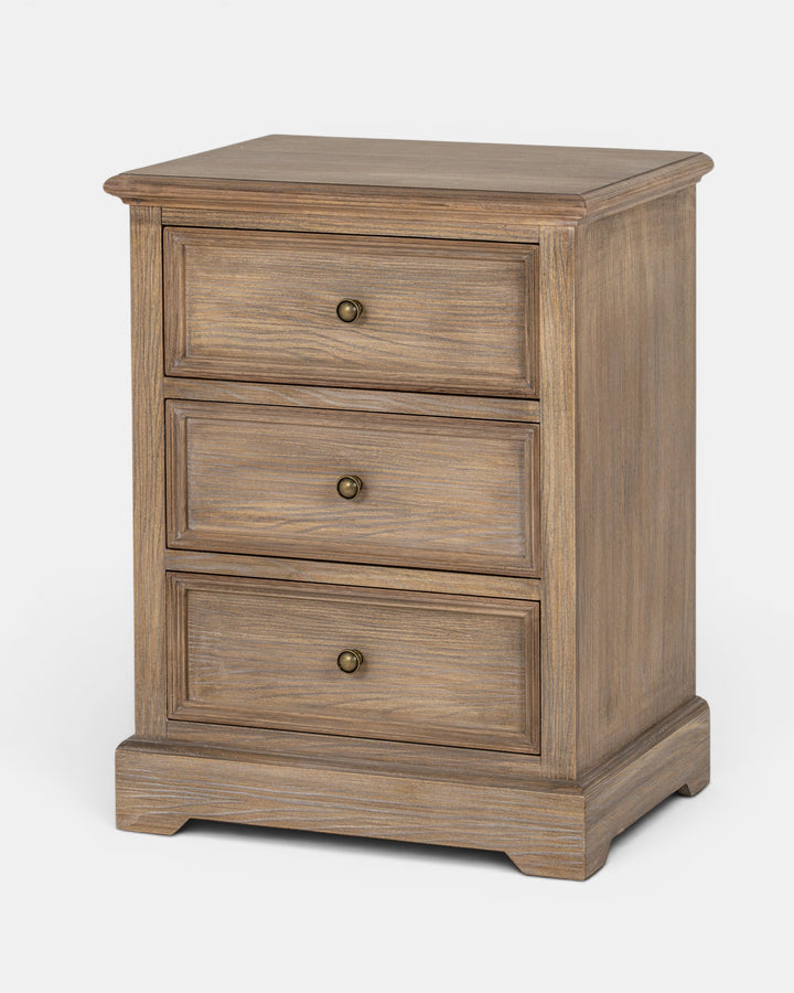 Wooden nightstand with three drawers on a white background