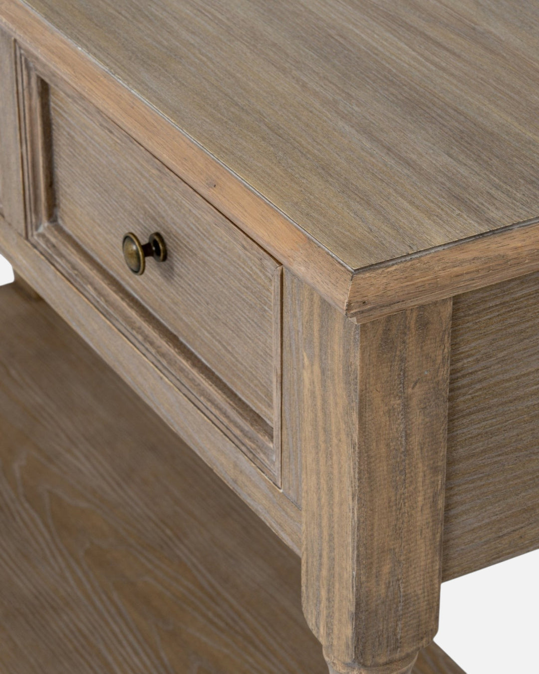Byretto Mercer console table in light brown wood with three drawers, lower shelf, and antique brass hardware.