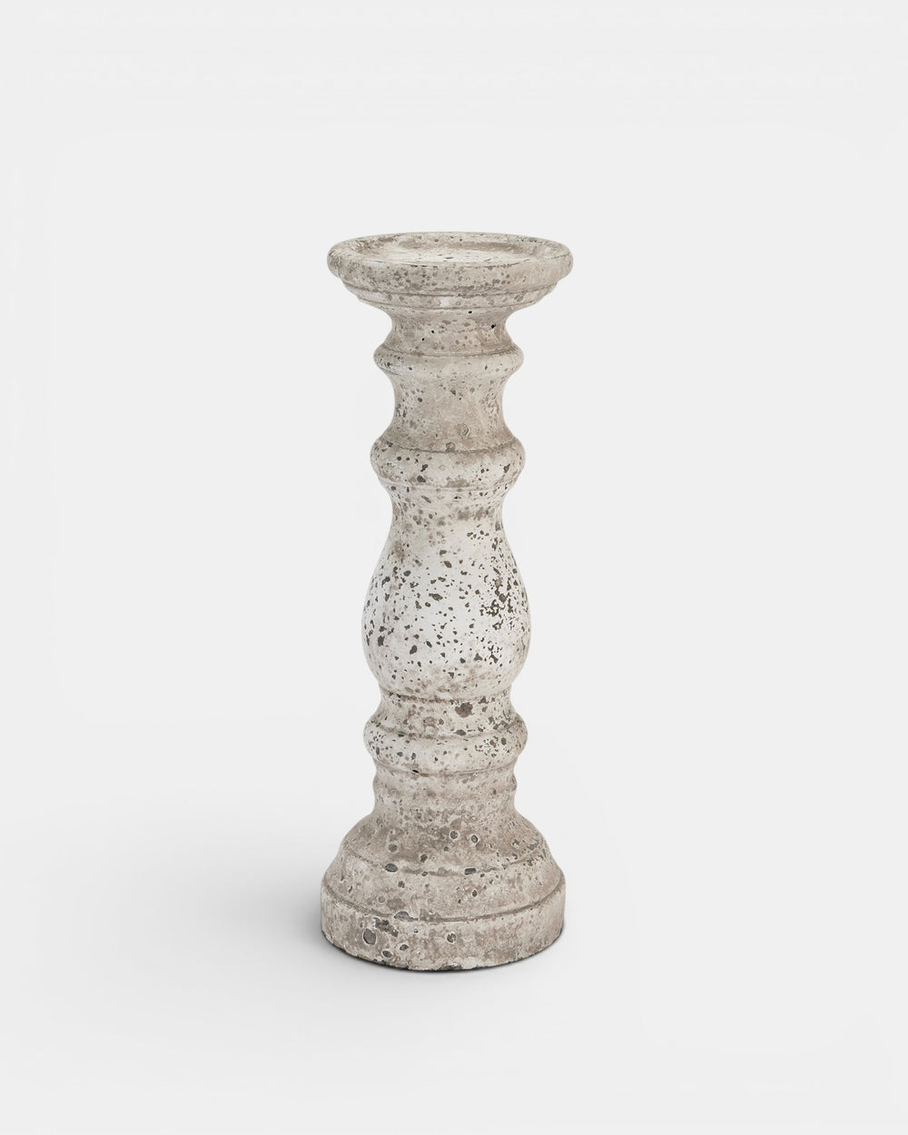 Decorative candle holder with textured surface on a white background