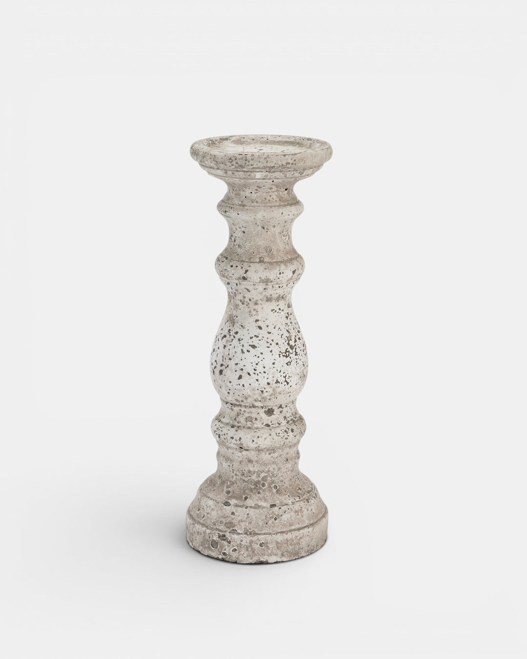 Decorative candle holder with textured surface on a white background
