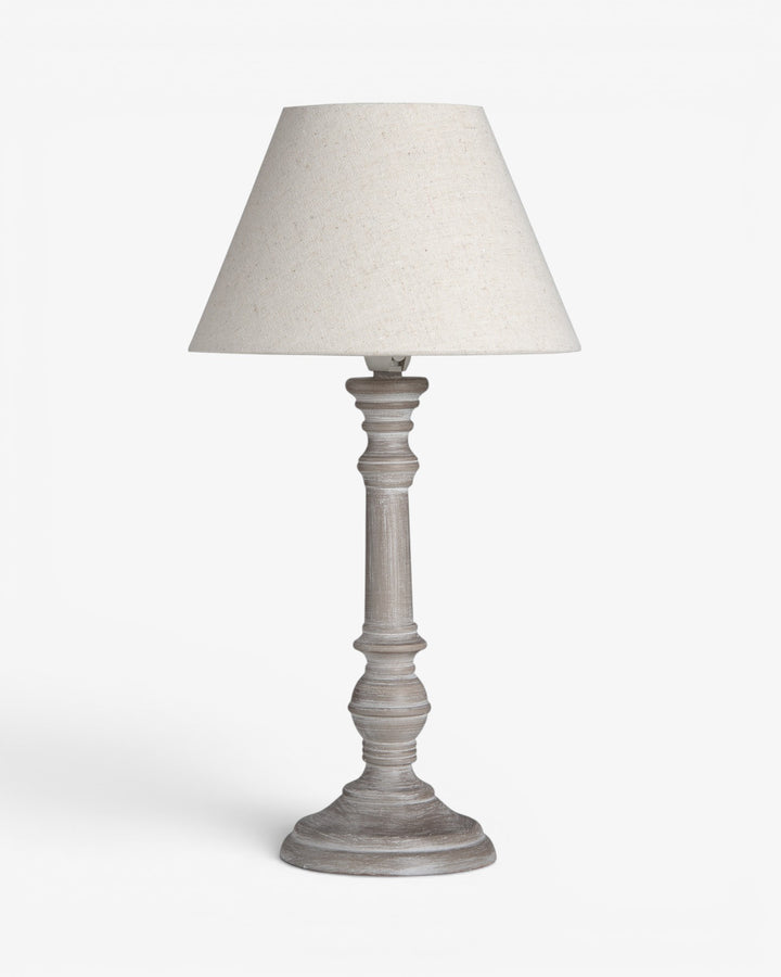 Table lamp with a white shade on a light gray background