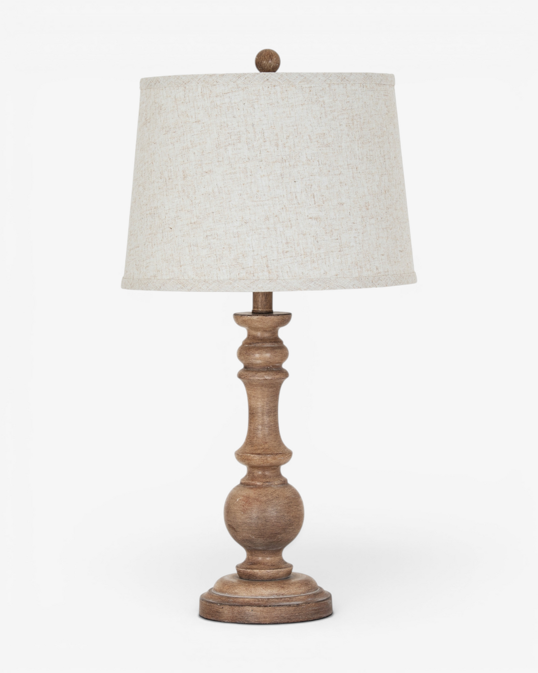 Table lamp with wooden base and beige lampshade on a white background