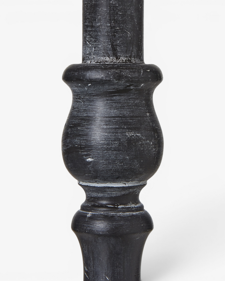 Black wooden table lamp detail on a white background