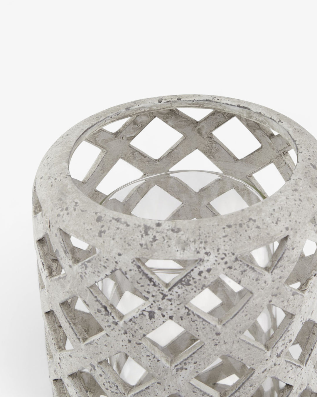 Decorative concrete lantern with lattice design on a white background